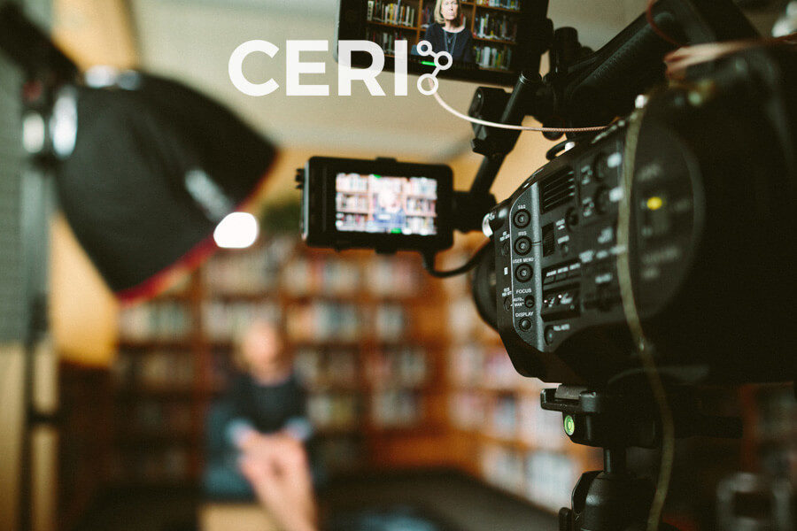A camera recording an interview with the logo of the Collaboration for Enhanced Research Impact (CERI) superimposed.