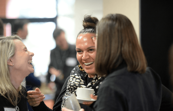 Participants enjoy a laugh during a break at an event