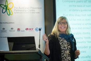 Amanda Lee smiling as she presents at a Prevention Centre event.