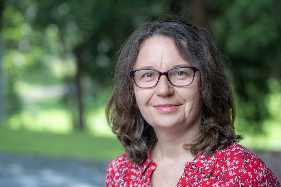 Headshot of Professor Lucie Rychetnik in s park.