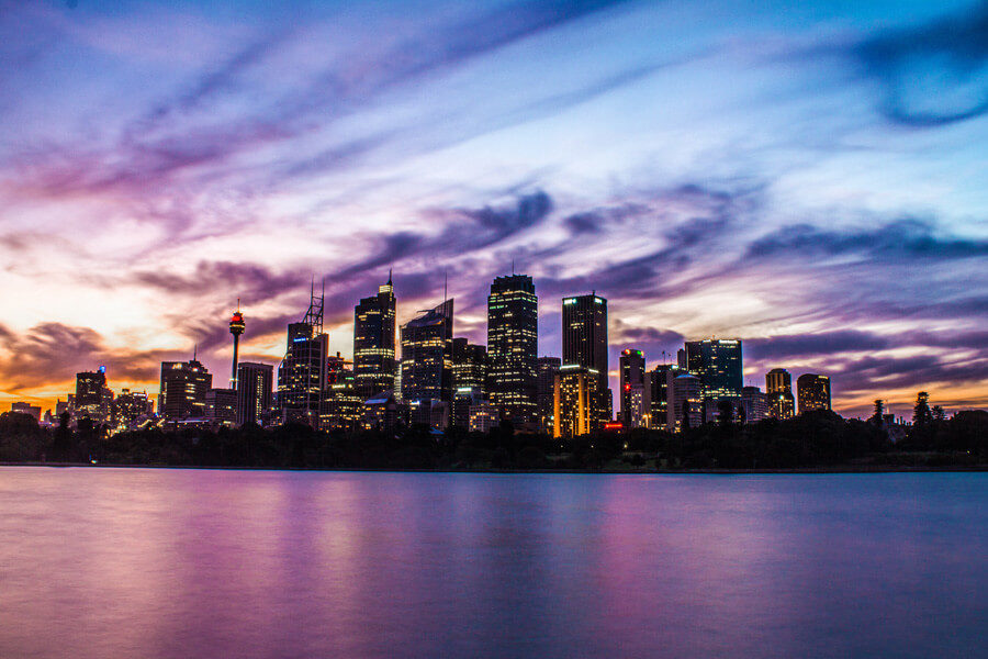 The Sydney cityscape from the harbour at sunset