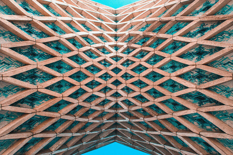 A dramatic modern building with a curved lattice framework