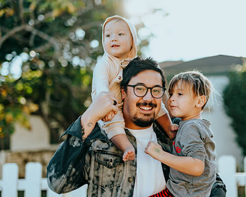 A happy father and his children enjoy the great outdoors. Photo by Nathan Dumlao.