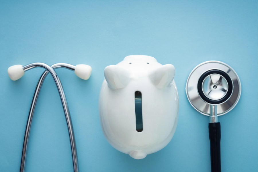 piggy bank and stethoscope