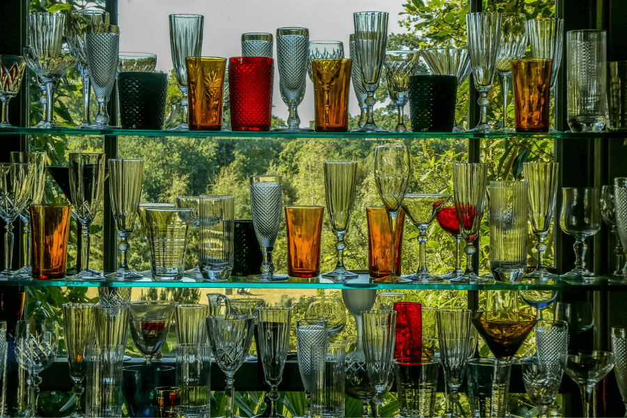 colourful bottles and glasses on shelves