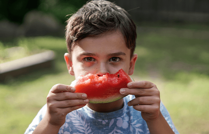 Boy eating watermelon