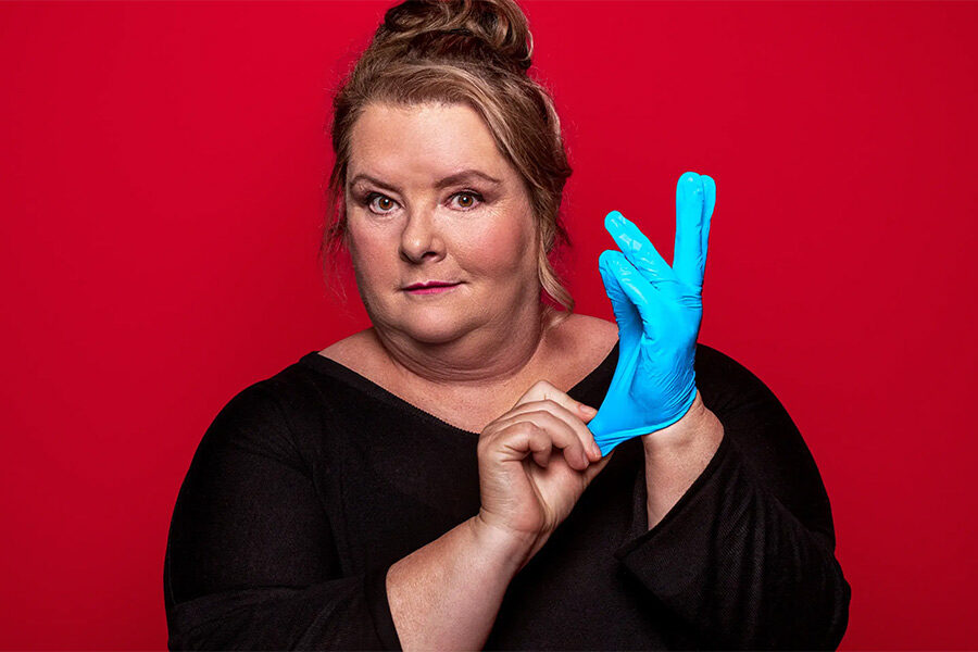 Promotional image for Magda's Big National Health Check showing Magda Szubanksi fitting a latex glove to her hand!