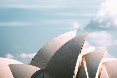 The roof of the Sydney Opera House, with dramatic clouds overhead.