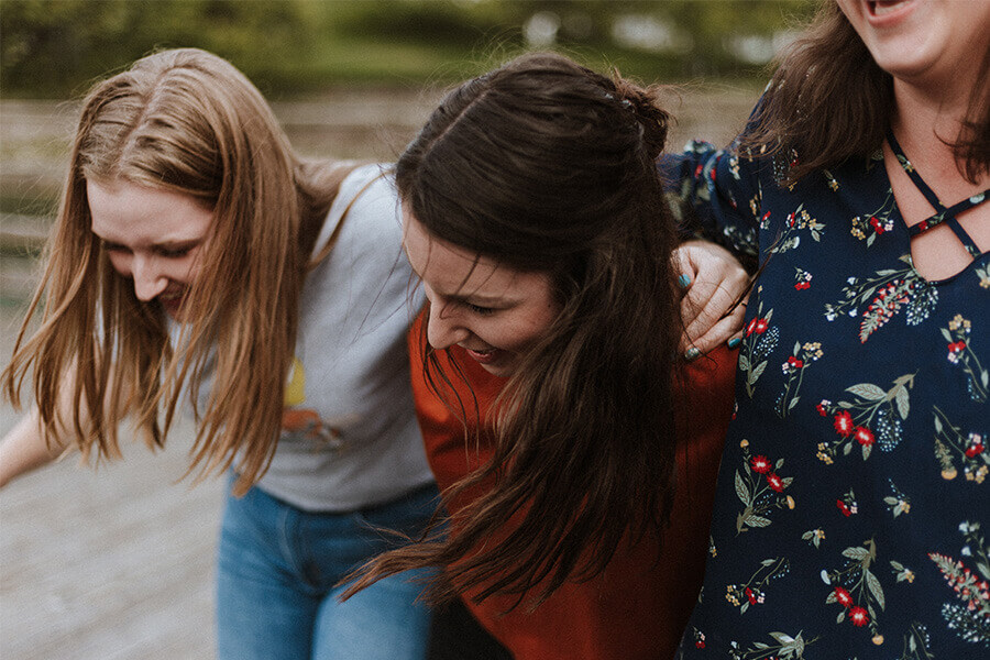 Young women laughing together