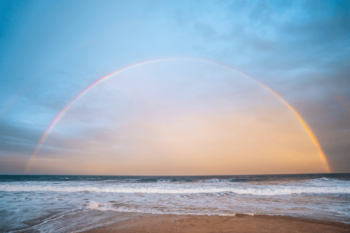 Rainbow in the sky over a beach