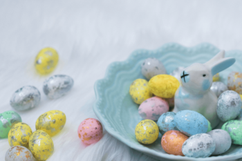 Coloured eggs and easter bunny in a bowl