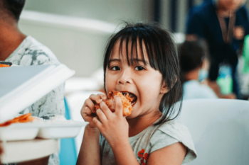 Young child eating food